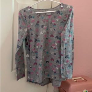 gray long sleeve top with hearts all over it